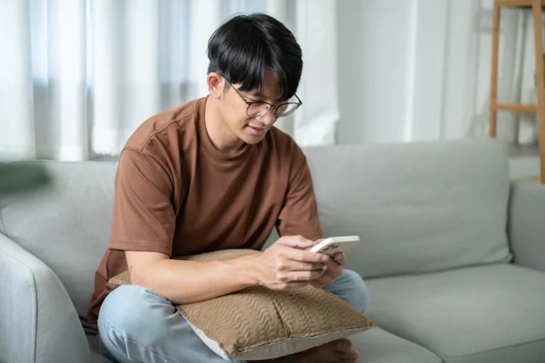 a youth male watching mobile