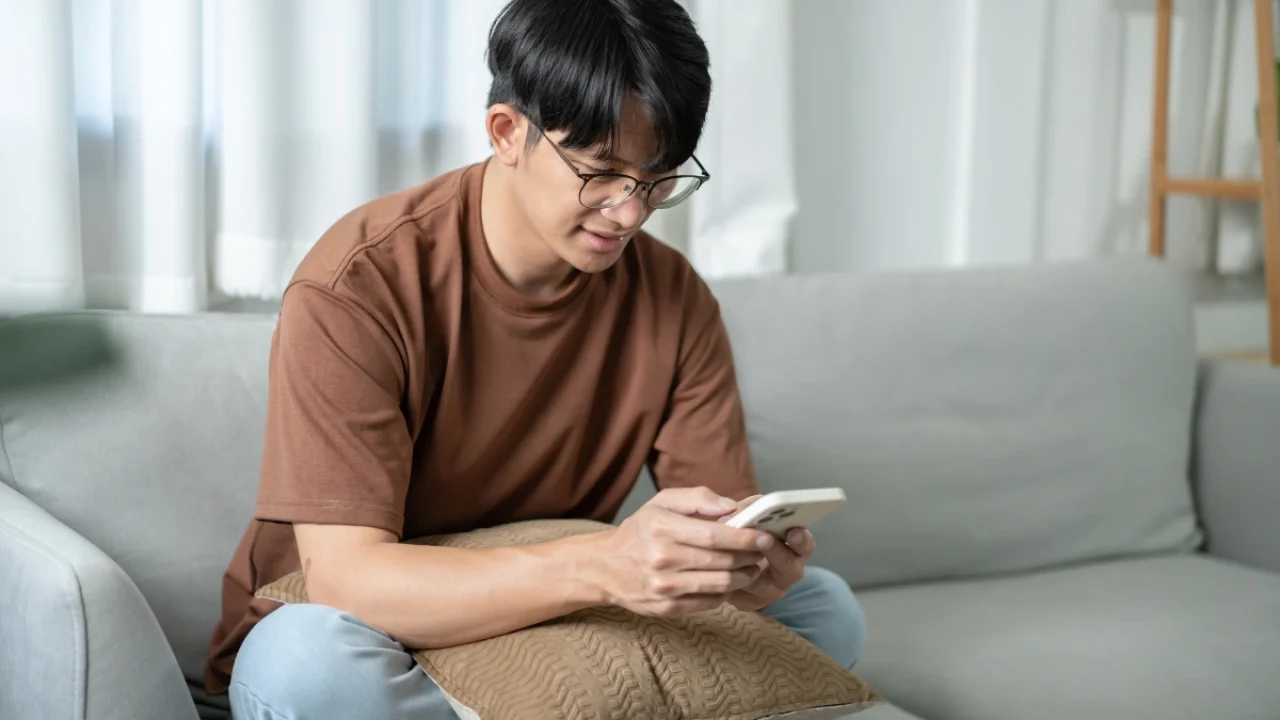 a youth male watching mobile